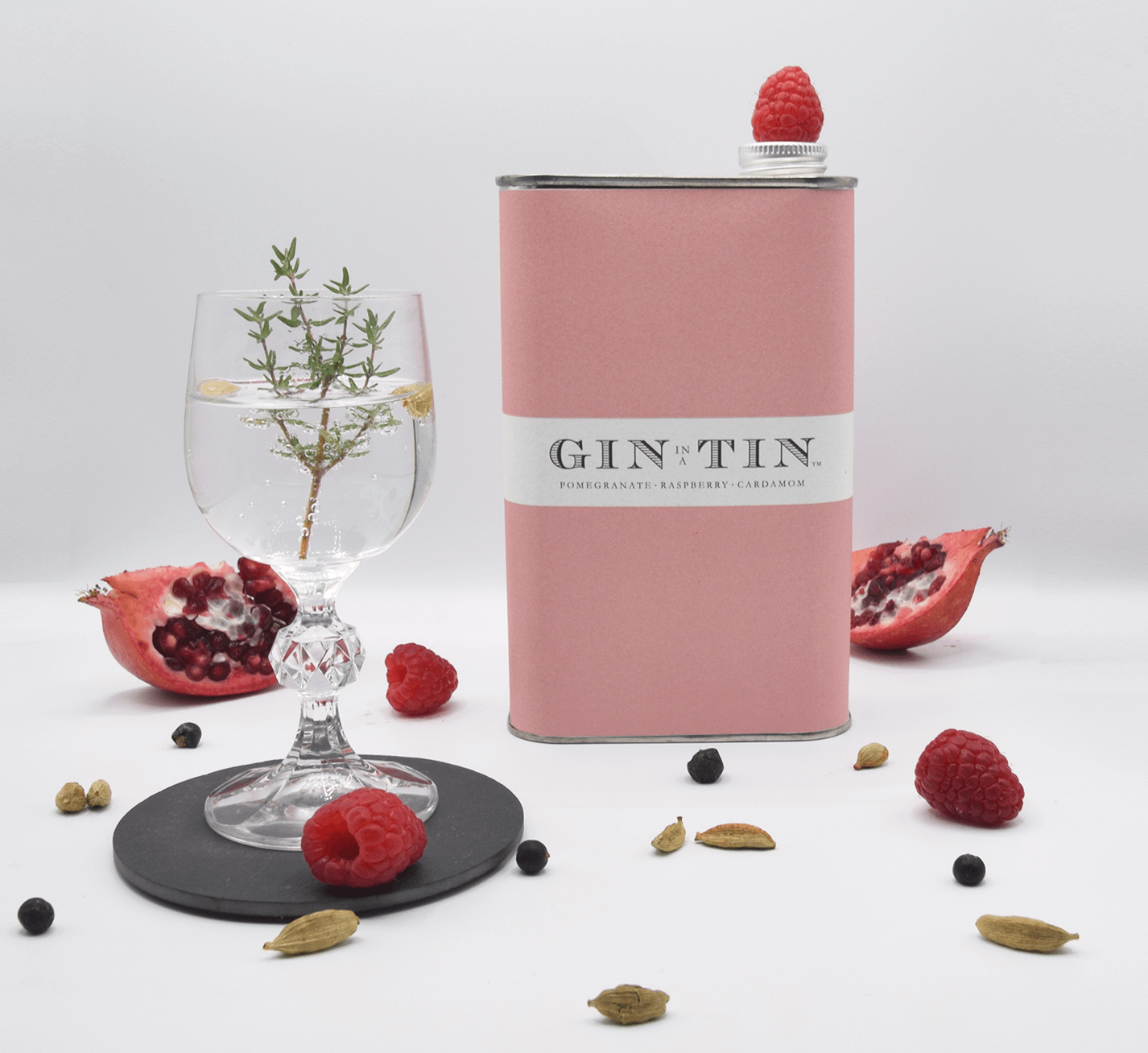 pomegranate, raspberry and cardamom gin in a pink tin